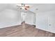 Bedroom featuring hardwood floors, a ceiling fan and multiple entryways at 12404 Mcallister Park Dr, Charlotte, NC 28277