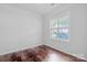 Bright bedroom with wood floors and a large window at 12404 Mcallister Park Dr, Charlotte, NC 28277