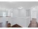 Bright, open hallway featuring hardwood floors, crisp white walls, and ample natural light at 12404 Mcallister Park Dr, Charlotte, NC 28277