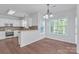 Cozy breakfast nook with white cabinets, granite counters, and natural light overlooking the backyard at 12404 Mcallister Park Dr, Charlotte, NC 28277