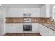 Well-equipped kitchen with stainless steel appliances, granite countertops, and mosaic backsplash at 12404 Mcallister Park Dr, Charlotte, NC 28277