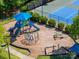 Aerial view of a colorful playground with slides, climbing structures, and play equipment at 12404 Mcallister Park Dr, Charlotte, NC 28277