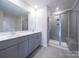A bathroom with a double vanity, shower, and tile flooring offers lots of space at 1441 31St Ne St, Conover, NC 28613