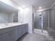 A bathroom with a double vanity, shower, and tile flooring offers lots of space at 1441 31St Ne St, Conover, NC 28613
