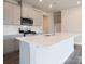 Well-lit kitchen with stainless steel appliances, gray cabinetry, a spacious island, and elegant tile backsplash at 1441 31St Ne St, Conover, NC 28613