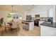 Modern eat-in kitchen with island, stainless steel appliances, and natural light from the window at 164 Hillndale Ln, Statesville, NC 28677