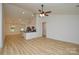 Spacious living area seamlessly connects to the kitchen, featuring wood-look floors and a ceiling fan at 164 Hillndale Ln, Statesville, NC 28677