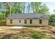 Features the back of the home with white vinyl siding, a new black roof, a door, and windows at 164 Hillndale Ln, Statesville, NC 28677