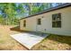 View of backyard with a white house, patio, and sunny skies at 164 Hillndale Ln, Statesville, NC 28677