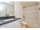 Bathroom features a vanity with dark countertop and a bathtub with shower head at 164 Hillndale Ln, Statesville, NC 28677
