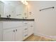 Bathroom featuring a white vanity, black hardware, and modern lighting at 164 Hillndale Ln, Statesville, NC 28677