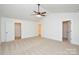 Spacious bedroom featuring neutral carpet, ensuite access, and ample closet space at 164 Hillndale Ln, Statesville, NC 28677
