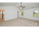 Bright, airy bedroom with neutral carpet and vaulted ceilings, awaiting personalization at 164 Hillndale Ln, Statesville, NC 28677