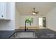 View from a kitchen sink, looking into a spacious living room and back entryway at 164 Hillndale Ln, Statesville, NC 28677