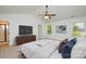 Spacious main bedroom featuring a ceiling fan, flatscreen television, and ample natural light at 164 Hillndale Ln, Statesville, NC 28677