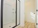 Modern walk-in shower with tile surround and glass door at 164 Hillndale Ln, Statesville, NC 28677