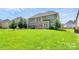 A backyard with a beautiful, well-maintained lawn, perfect for outdoor relaxation and entertainment at 2003 Dataw Ln, Indian Trail, NC 28079