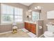 Bright bathroom features a double sink vanity, neutral finishes, and large window at 2003 Dataw Ln, Indian Trail, NC 28079
