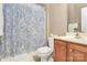 Bathroom with a shower curtain, toilet, and a single sink at 2003 Dataw Ln, Indian Trail, NC 28079