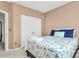 This bedroom includes neutral walls, an ensuite bathroom, and a ceiling fan and light at 2003 Dataw Ln, Indian Trail, NC 28079