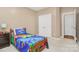 A cozy bedroom with a dinosaur theme and double door closet at 2003 Dataw Ln, Indian Trail, NC 28079