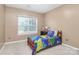 A bedroom with a dinosaur theme and natural light at 2003 Dataw Ln, Indian Trail, NC 28079