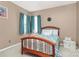 This bedroom has a window, neutral walls, and wooden furniture at 2003 Dataw Ln, Indian Trail, NC 28079
