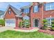Charming exterior showcasing brick facade, manicured landscaping, and a welcoming front entrance at 2003 Dataw Ln, Indian Trail, NC 28079