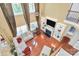Second-story view of a living room with high ceilings, built-in shelving, fireplace, and hardwood floors at 2003 Dataw Ln, Indian Trail, NC 28079