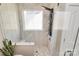 This shower has marble-look tile, multiple shower heads, a window, and a tiled seat at 2003 Dataw Ln, Indian Trail, NC 28079