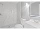 Bathroom featuring white marble walls, dark floors, shower, toilet and modern sink at 2019 Kingston Rd, Kingstown, NC 28150