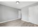Bedroom with neutral walls, white trim, white doors and light hardwood floors at 2019 Kingston Rd, Kingstown, NC 28150