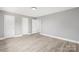 Bedroom with neutral walls, white trim, white doors and light hardwood floors at 2019 Kingston Rd, Kingstown, NC 28150