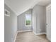Bedroom features neutral walls, white trim, a window with green view, and light hardwood floors at 2019 Kingston Rd, Kingstown, NC 28150