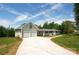 Charming home featuring an attached two-car garage, complemented by a well-manicured lawn and a long driveway at 2019 Kingston Rd, Kingstown, NC 28150