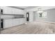 Bright kitchen with stainless steel appliances, granite countertops, wood flooring and white cabinets at 2019 Kingston Rd, Kingstown, NC 28150