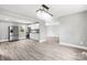 Clean kitchen with modern appliances, sleek white cabinets, wood flooring, and fresh gray paint at 2019 Kingston Rd, Kingstown, NC 28150