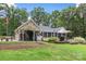Backyard showcasing a well-maintained lawn, inviting patio, and lush landscaping at 206 Oxford Place Dr, Fort Mill, SC 29715