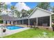 Spacious backyard featuring a sparkling swimming pool and well-manicured lawn at 206 Oxford Place Dr, Fort Mill, SC 29715
