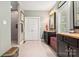 Bathroom featuring dual vanities with granite countertops and tiled floor at 206 Oxford Place Dr, Fort Mill, SC 29715