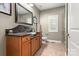 Bathroom with a unique vanity, modern fixtures, and a glass-enclosed shower at 206 Oxford Place Dr, Fort Mill, SC 29715