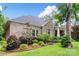 Well-maintained brick home with manicured landscaping and healthy greenery, showcasing an elegant, inviting exterior at 206 Oxford Place Dr, Fort Mill, SC 29715