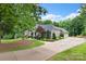 Spacious home with an expansive driveway and well-maintained landscaping, offering plenty of parking. Three-car garage at 206 Oxford Place Dr, Fort Mill, SC 29715