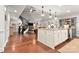Spacious kitchen featuring a large island, granite countertops, and modern pendant lighting at 206 Oxford Place Dr, Fort Mill, SC 29715