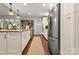 Well-equipped kitchen with stainless steel refrigerator, granite island, and ample cabinet space at 206 Oxford Place Dr, Fort Mill, SC 29715