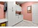 Bright laundry room with white cabinets and plenty of storage space at 206 Oxford Place Dr, Fort Mill, SC 29715