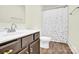 A bathroom features a sink, toilet, and wood-look floors at 207 Aspire Cir # 46, Wingate, NC 28174