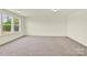 Bedroom featuring neutral carpeting, walls, and window at 207 Aspire Cir # 46, Wingate, NC 28174
