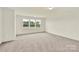 An airy bedroom with large windows offering natural light and nature views at 207 Aspire Cir # 46, Wingate, NC 28174