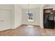 Dining room has an open layout with hardwood floors and a modern light fixture at 207 Aspire Cir # 46, Wingate, NC 28174